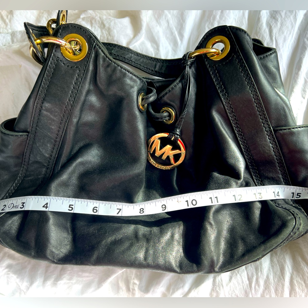 Black leather Michael Kors drawstring bag